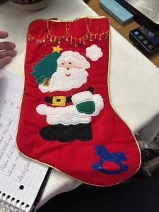 Calza di Natale, Babbo Natale che tiene un albero, cavallo a dondolo blu - Foto 1 di 6