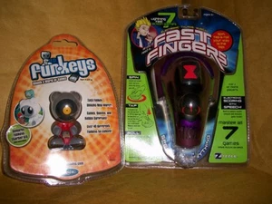 FAST FINGERS 7 SPIELE IN 1 & UB FUNKEYS HANDHELD COMPUTER BEIDE NEU - Bild 1 von 3
