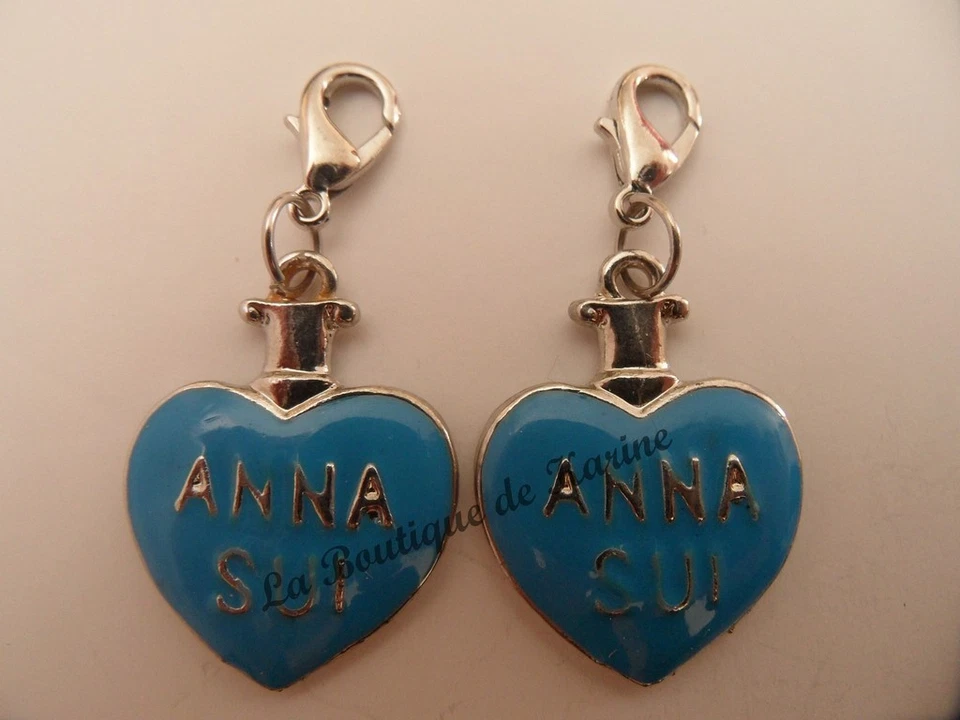 2 CHARMS BRELOQUE CHIUSURA METALLO ARGENTO FORMA CUORE BLU - BRACCIALE PERLE - Immagine 1 di 1