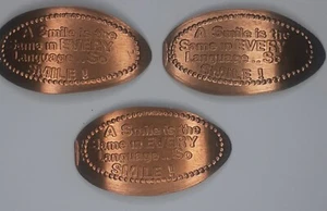 ONE x A SMILE IS THE SAME IN EVERY LANGUAGE SO SMILE Centavo Alargado de Cobre Penny - Imagen 1 de 2