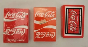 Drei Decks Coca-Cola Spielkarten - zwei versiegelt, eines geöffnet und vollständig - Bild 1 von 24