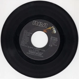Ronnie Milsap - It Was Almost Like A Song; It Don't Hurt To Dream - Vinyl 45 RPM - Picture 1 of 2