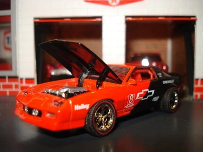 1985 CHEVROLET CAMARO IROC-Z CUSTOM EDITION COUPE M2 1/64 RED W/ CHROME WHEELS - Image 1 of 4