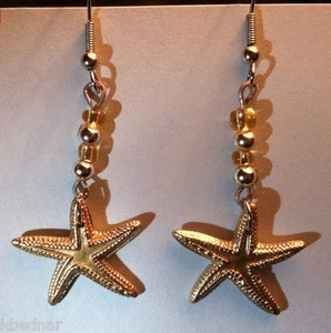 Ohrhänger Ohrhänger Stern Fisch sandfarben Anhänger & Perlen NEU - Bild 1 von 1