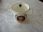 Commemorative mug Queens 50th wedding anniversary 1947-1997 with Swindon marking