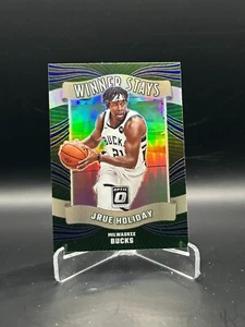 2023-24 DONRUSS OPTIC JRUE HOLIDAY WINNER RIMANE HOLO PRIZM #9 CELTICS BUCKS - Foto 1 di 1