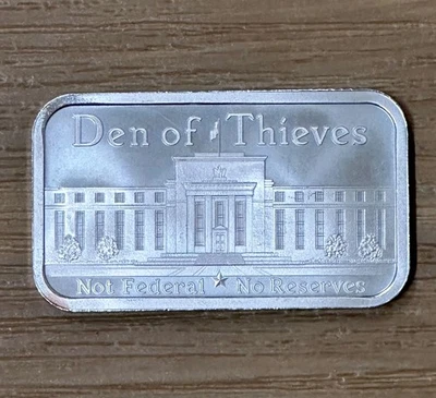 Den of Thieves 1 oz .999 Silver Shield Bar Not Federal & NO Reserves - Image 1 of 4