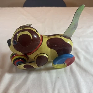 Ruote giocattolo cane cucciolo di latta vintage coda di spinta e rotoli si muove - Foto 1 di 5