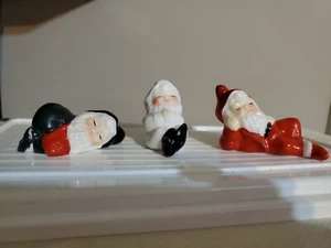 VINTAGE 3 CERAMIC CHRISTMAS SLEEPING POSING SANTA ELF FIGURINES - Picture 1 of 12
