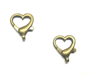 Antiguo broche de garra de langosta de latón 22 mm grande corazón abierto - paquete de 2 - Imagen 1 de 1