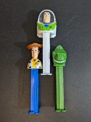 Lote de 3 dispensadores de caramelos Toy Story Woody Buzz Lightyear & Rex PEZ Foto 1 de 4