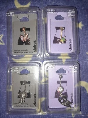 Lote de 4 plumas mariposa elefante estrella acero y titanio Claire's ombligo Foto 1 de 4