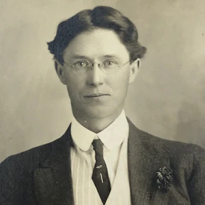 Real Photo Postcard of Young Man in Suit, Tie, Glasses, Top Hat 1904-1918 RPPC - Picture 1 of 3