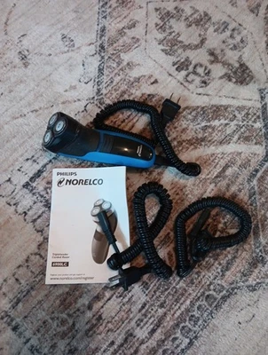 Afeitadora giratoria Philips Norelco 1100 para hombre 6900LC azul/negro con 2 cables e instrucciones Foto 1 de 4