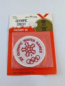 Calgary XV 1988 Juegos Olímpicos de Invierno Canadá emblema escudo parche '88 nuevo en paquete - Imagen 1 de 2