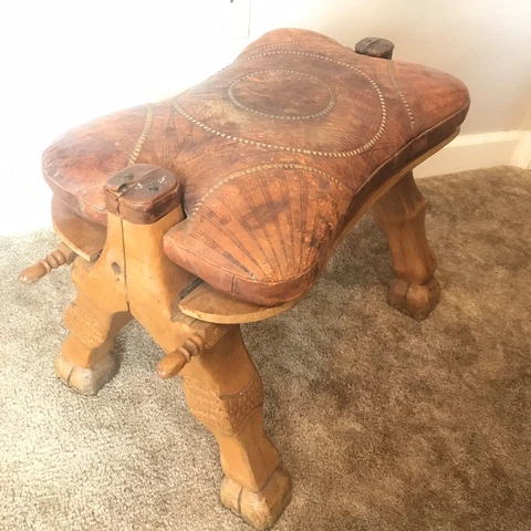 Vintage Camel Saddle Ottoman Hand Tooled Geometric Leather Carved Wood Leg Motif Cover