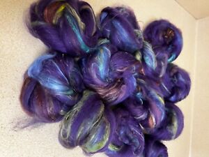 Hand carded 90% Merino, 10% silk. made by a local artist, 2 nest 2.5 oz