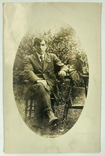 Man, Chair, Table, Post Card - Roy Hitchcock