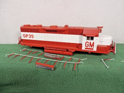 ATLAS O GM DEMONSTRATOR GP-35 EMD LOCOMOTIVE DECORATED CAB, FRAME, HANDRAILS - Image 1 of 4