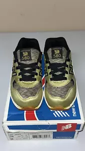 New Balance Toddler 580 Classics Gold Black Shoes Size 9.5 Unisex - Picture 1 of 8