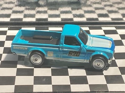 Camioneta pickup Datsun 620 1/64 neumáticos de goma azul M10 Foto 1 de 4