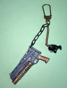 Purse - Belt Charm, G.I. Joe Toy Gun That Folds up, And Plastic Orca Dangly. - Picture 1 of 4