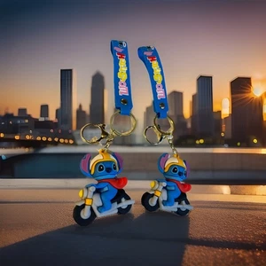 A Lot Of Two Lilo & Stitch On A Motorcycle With A Red Cape Keychains - Picture 1 of 4