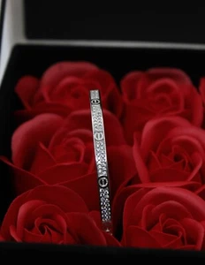 BRACCIALE ANELLO ARGENTO VITI PAVÉ ZIRCONI BIANCHI RIGIDO diam 58 x 50h EXPLOIT - Foto 1 di 11