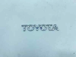 SCRITTA TOYOTA LOGO EMBLEMA SIGA BADGE FREGIO POSTERIORE ORIGINALE - Foto 1 di 5