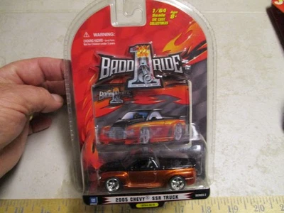 2005 CHEVY SSR TRUCK  DIE-CAST BADD RIDE 1:64 SCALE RARE Orange & Black NEW - Image 1 of 4