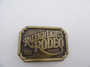 Belt Buckle Raleigh Lights Rodeo 1981 Brass "PJ" on Back 3x2 - Picture 1 of 2