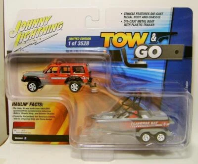JEEP CHEROKEE XJ V/B W/ BOAT AND TRAILER TOW & GO JOHNNY LIGHTNING 2023 - Image 1 of 4