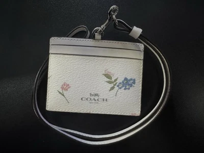 Estuche para tarjetas de identificación Coach con patrón floral blanco usado en excelente estado Foto 1 de 2