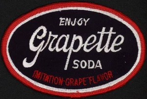 Vintage uniform patch Enjoy GRAPETTE SODA small oval shape new old stock n-mint+ - Picture 1 of 2