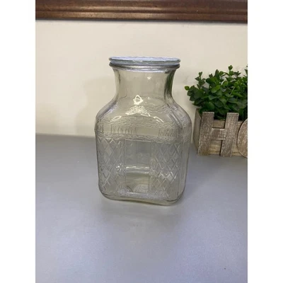 Jarra jarra de vidrio transparente en relieve con tapa utensilios de cocina vintage Foto 1 de 4