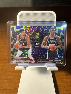 Victor Wembanyama/David Robinson 2024-25 Donruss Optic Optical Illusions púrpura Foto 1 de 2