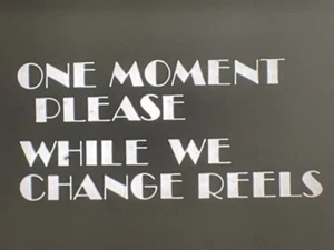 16mm SNIPE "ONE MOMENT PLEASE WHILE WE CHANGE REELS" - Bild 1 von 2