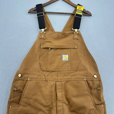 Mono con tirantes aislado Carhartt Firm Duck ropa de trabajo holgada L corto OR4393-M Foto 1 de 4