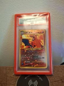 PSA7 2000 Pokemon P.M. Japanese NEO 2 Charizard Promo - Reverse Foil 105 Swirl - Picture 1 of 2