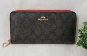 Coach Geldbörse mit umlaufendem Reißverschluss in charakteristischem braun/schwarz rotem Canvas Top Zustand  - Bild 1 von 14