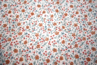 GOLD AND PINK FLOWERS  ON TAN FROM JOAN KESSLER - 100% COTTON FABRIC - Image 1 of 3