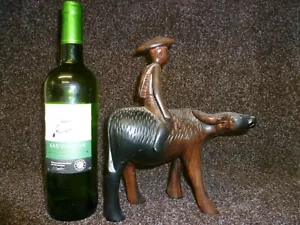 AN ANTIQUE CARVED WOODEN FIGURINE OF A CHINESE PEASANT FARMER ON A WATER BUFFALO - Picture 1 of 12
