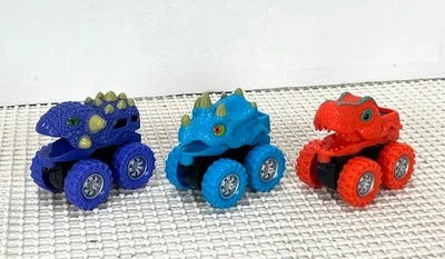 Lot Of 3 Dinosaur Head  Monster Trucks - Image 1 of 4