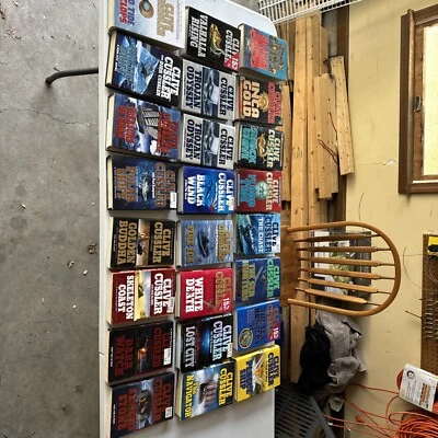 Lot of 24 CLIVE CUSSLER Books 20 Hardcover W/Dust Jacket 4 Paperback 1st Prints - Image 1 of 3