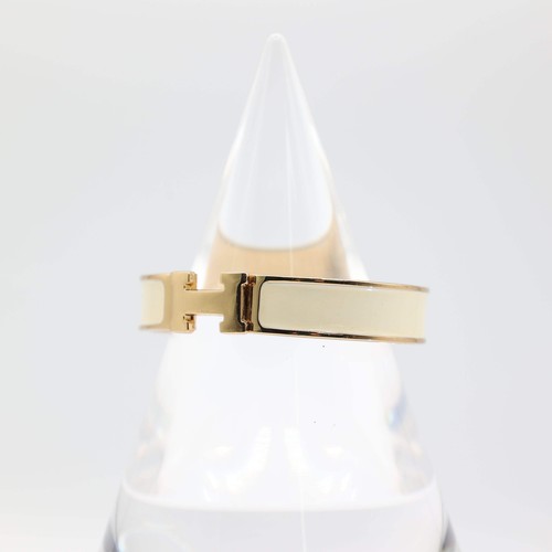 HERMÈS Bracciale HERMES "H" placcato oro giallo con colore panna