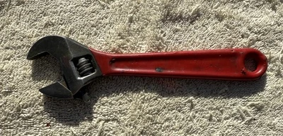 UNBRANDED 6 INCH ADJUSTABLE WRENCH WITH RED INSULATED HANDLE - Image 1 of 4