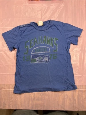 Camiseta azul de fútbol americano Seattle Seahawks para niños talla 8 comida chatarra marca NFL gráfico Foto 1 de 4