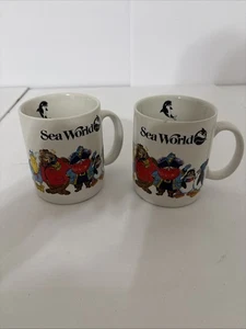 Ein Paar Vintage 1980 SeaWorld animierte Shamu Crew Kaffeetassen Orca Wal - Bild 1 von 6