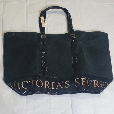 Bolso de Mano Victoria's Secret Negro con Glamorosa Marca Metálica 23X15" Foto 1 de 4