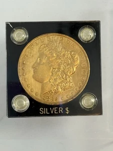 1882-O Morgan Silver Dollar with a gold tone plate in plastic case - Picture 1 of 6